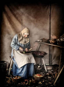 Author Elizabeth Chadwick in medieval period dress at a re-enactment event with Regia Anglorum